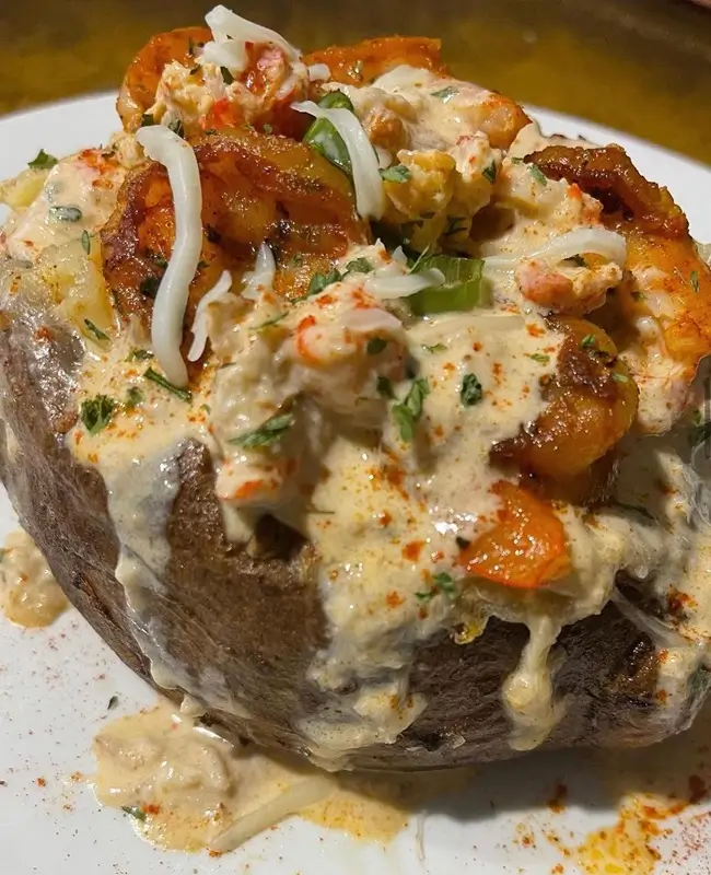 Seafood loaded potato - Crab, shrimp & crawfish with a Cajun cream sauce