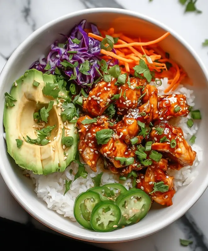 Close-up of creamy homemade bang bang sauce in a small white bowl, made with mayonnaise, sweet chili sauce, sriracha, honey, and lime juice