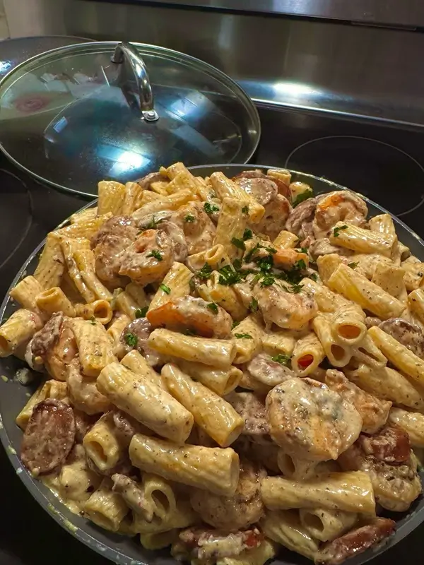 Small bowls of spices including smoked paprika, cayenne, garlic powder, and thyme for homemade Cajun seasoning blend