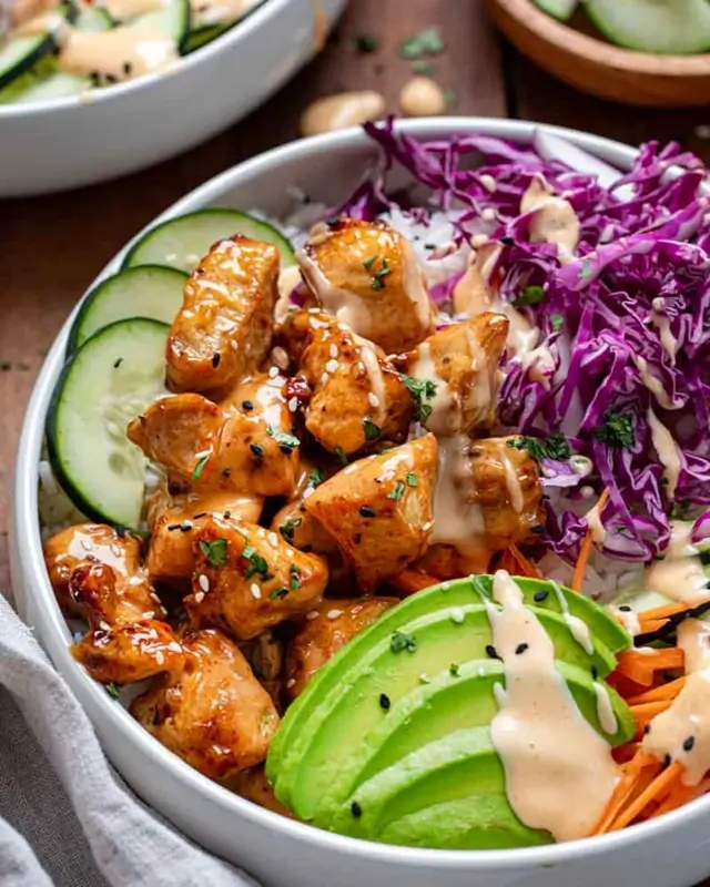 Step-by-step process of making a bang bang chicken bowl at home, from cooking seasoned chicken to assembling the bowl with rice and fresh vegetables